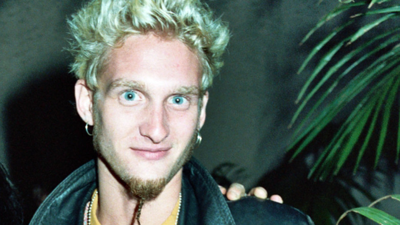 layne staley wided eyed with harry shearer by palm fronds