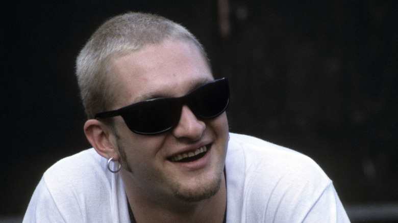 Layne Staley with shorn hair sunglasses smiling