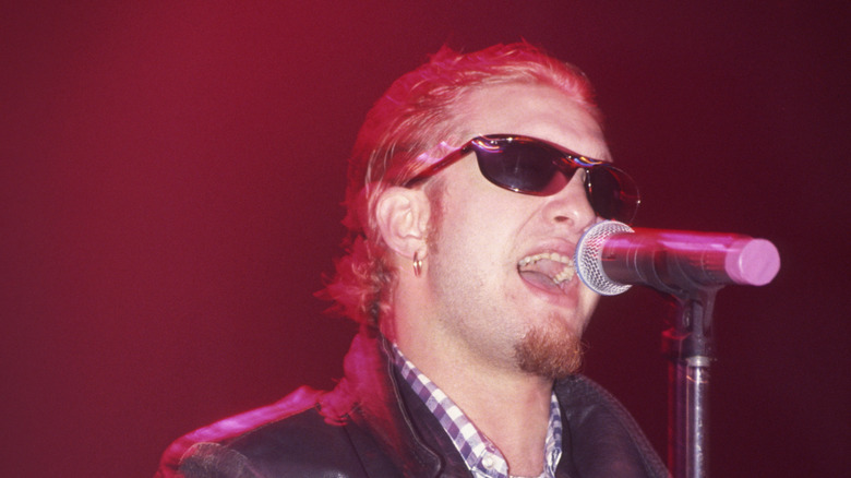 layne staley with sunglasses and leather jacket singing