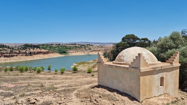 Sunny lake square white building Algeria