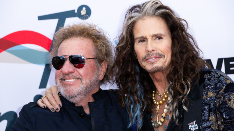 steven tyler with his arm around sammy hagar in sunglasses