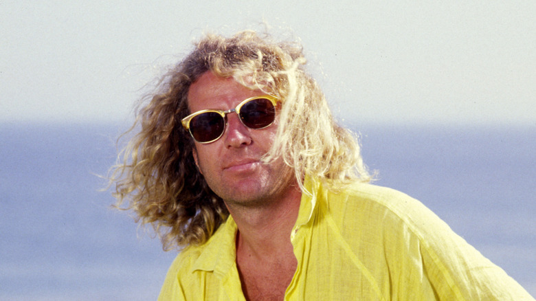 sammy hagar in a yellow shirt on the beach