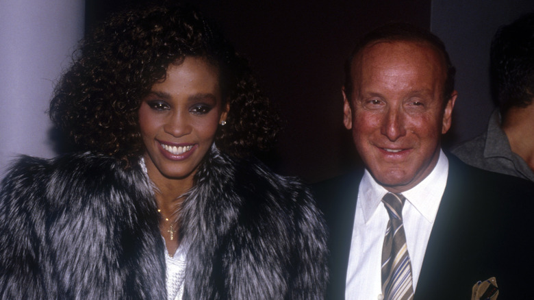 whitney houston in fur coat with clive davis