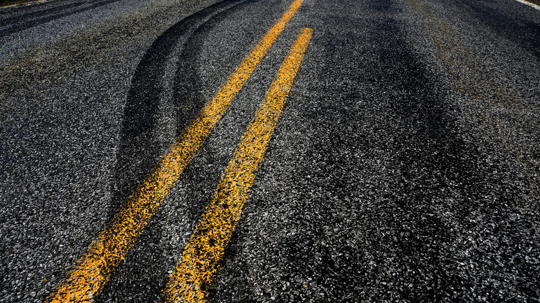 Skid marks in wrong lane of two-lane road