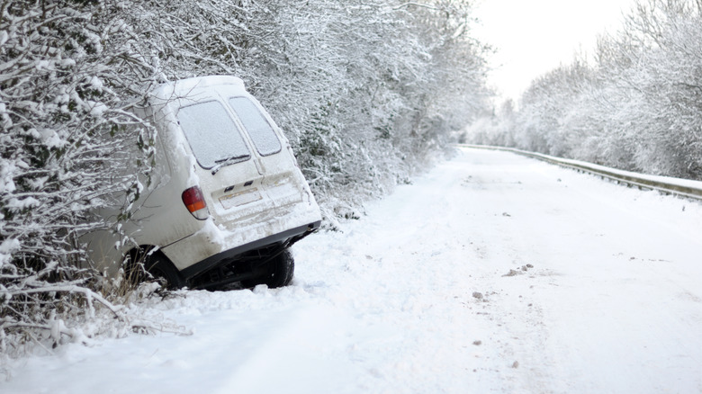 A vehicle crashed into trees in the snow