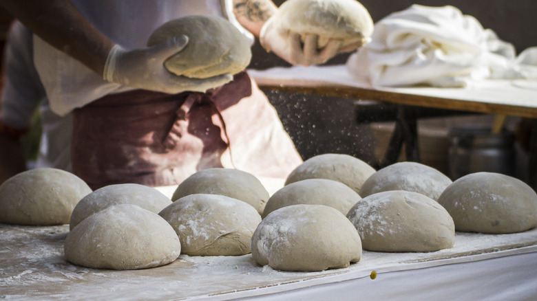 baker making bread loaves