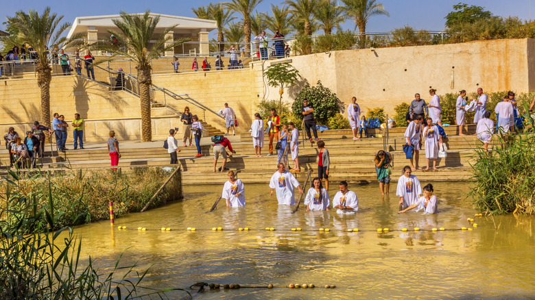 pilgrims being baptized in the jordan