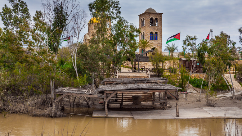 wooden structures along west bank of Jordan river 