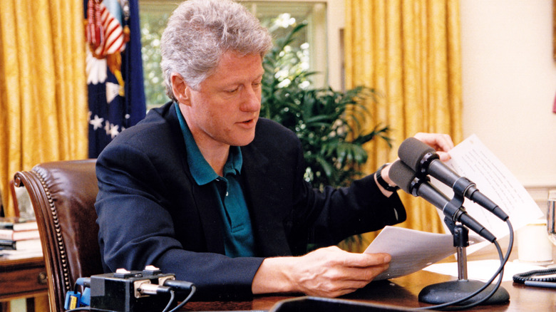 Bill Clinton sitting in the Oval Office