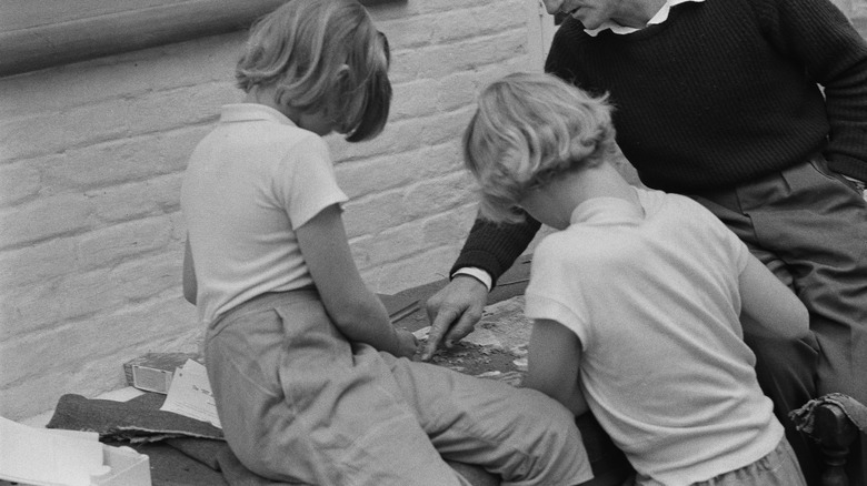 Family assembling a jigsaw puzzle