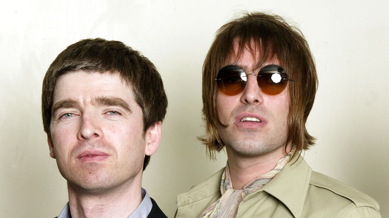 Noel and Liam Gallagher staring ahead