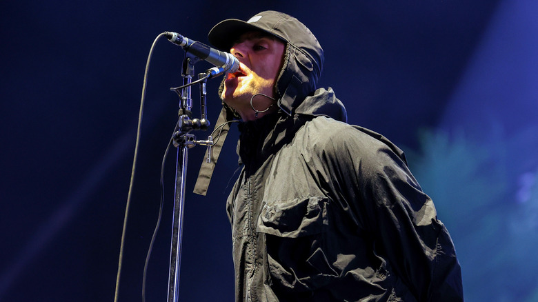 Liam Gallagher singing at microphone