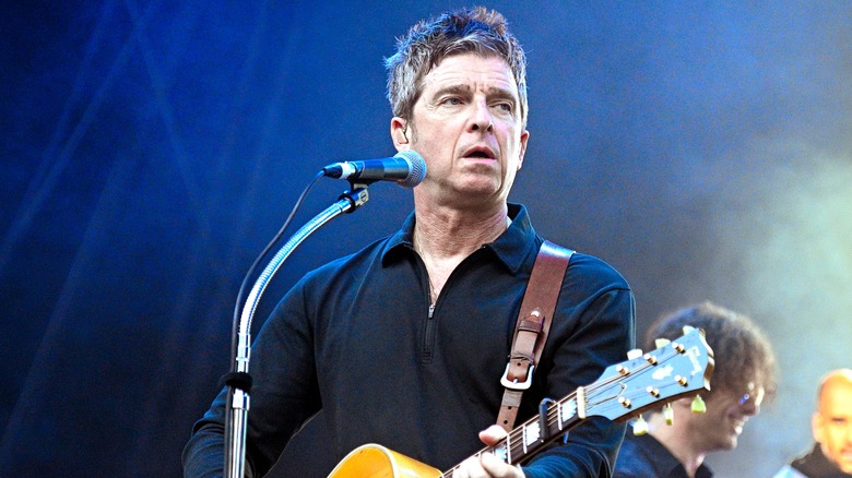 Noel Gallagher performing on stage