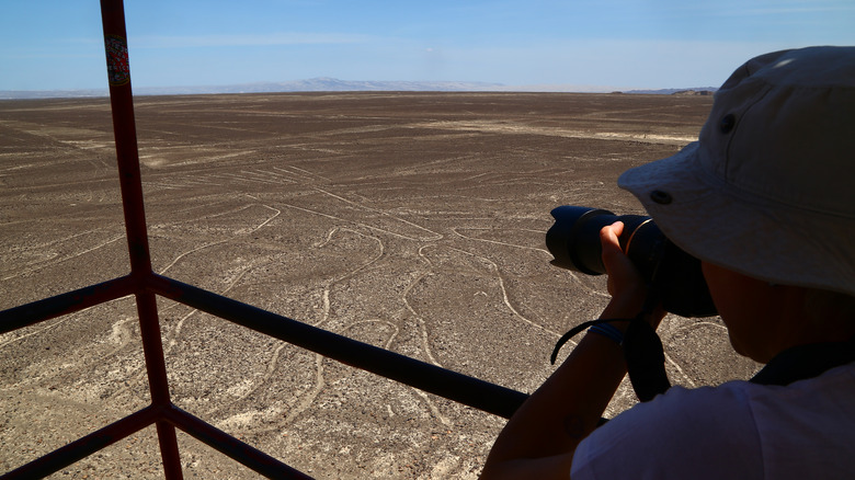 A man photographs the Nazca lines