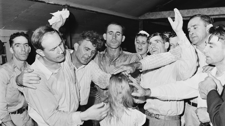 Healing "laying on of hands" ceremony in the Pentecostal Church of God. Lejunior, Harlan County, Kentucky