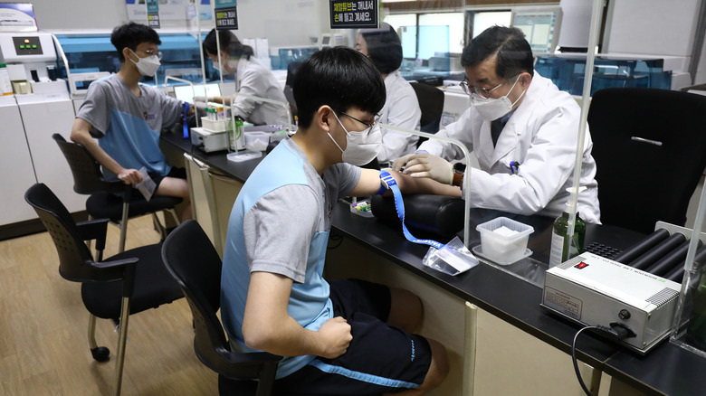 South Korean teens getting blood test