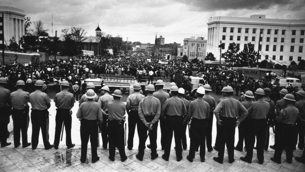 1965: A line of policemen on duty during a black voting rights march in Montgomery, Alabama