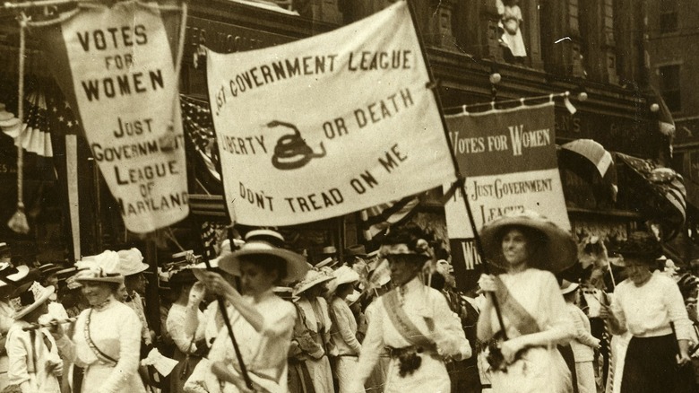 Women march in 1913 suffrage parade