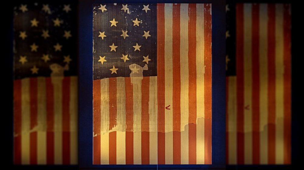 The large Star Spangled Banner Flag that inspired the lyrics of the US national anthem when it flew above Fort McHenry in the 1814 Battle of Baltimore. Shown here on display at the Smithsonian's National Museum of History and Technology, around 1964