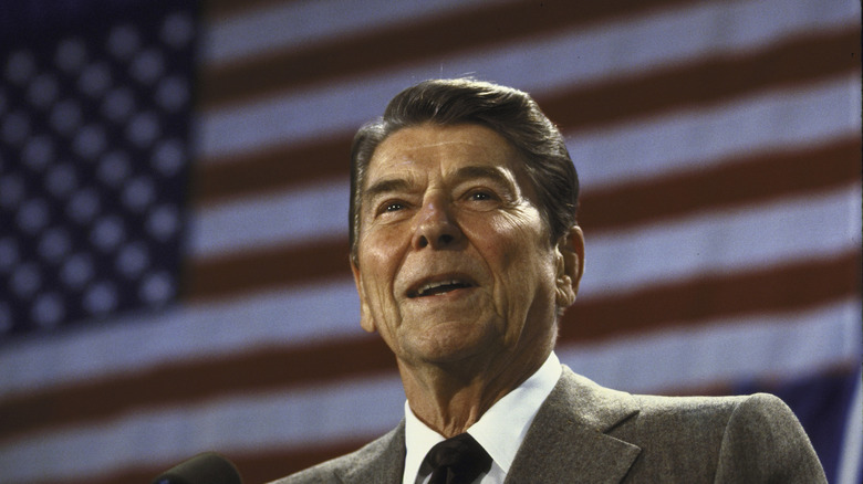 Ronald Reagan in front of an American flag