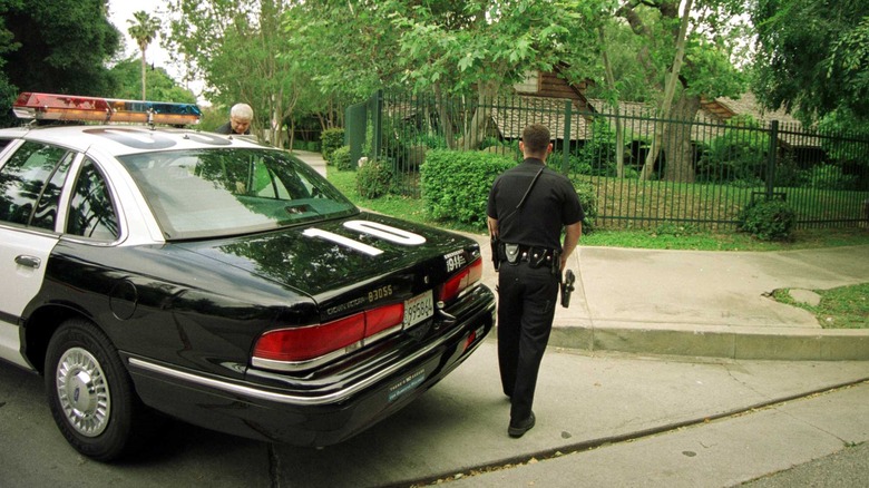 Police officers car Hartman house