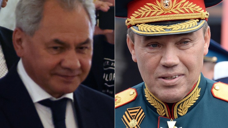 Sergei Shoigu smirking in suit and Valery Gerasimov smiling in military regalia