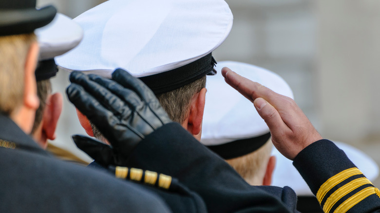 Royal navy officers giving salute 