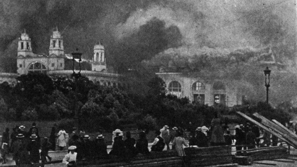 Spectators watch the White City burn