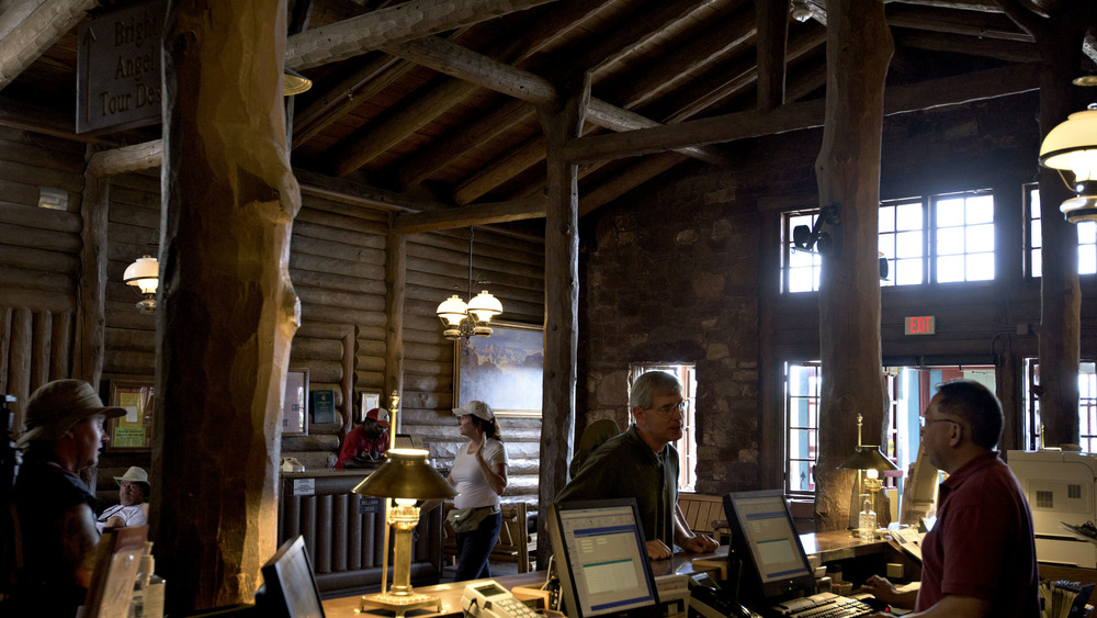 a visitor checks into Bright Angel Lodge