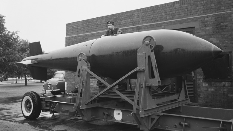 soldier inspecting grand slam bomb