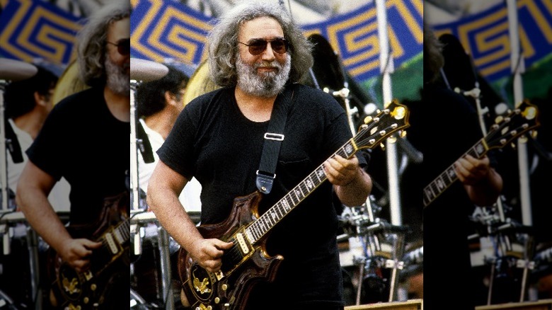 Jerry Garcia in sunglasses smiling