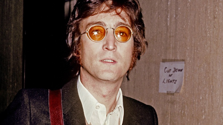 John Lennon in orange-tinted frames