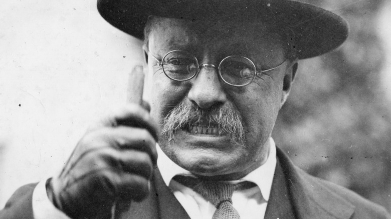 Theodore Roosevelt grips a cane