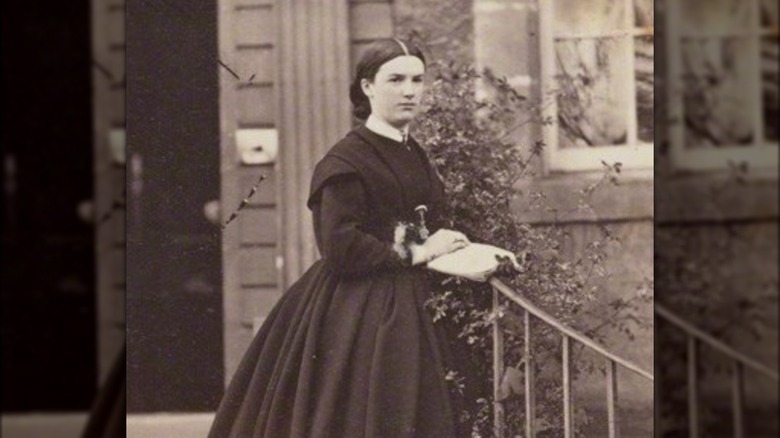 Harriet Mourdaunt posing on stairs