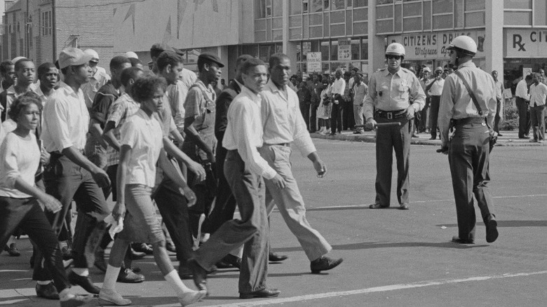 Civil Rights protestors on street marching