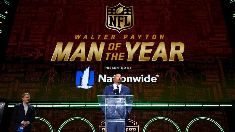 Andrew Whitworth presenting Walter Payton award