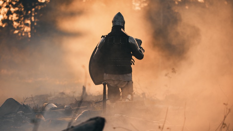 Medieval knight on battlefield after battle