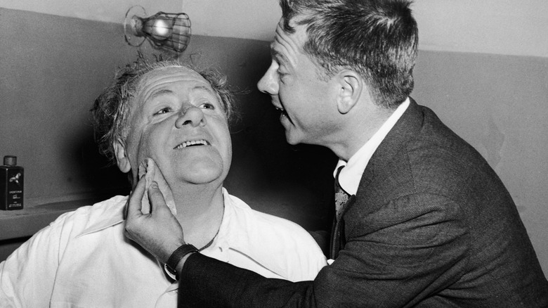 Mickey Rooney cleans his father's face