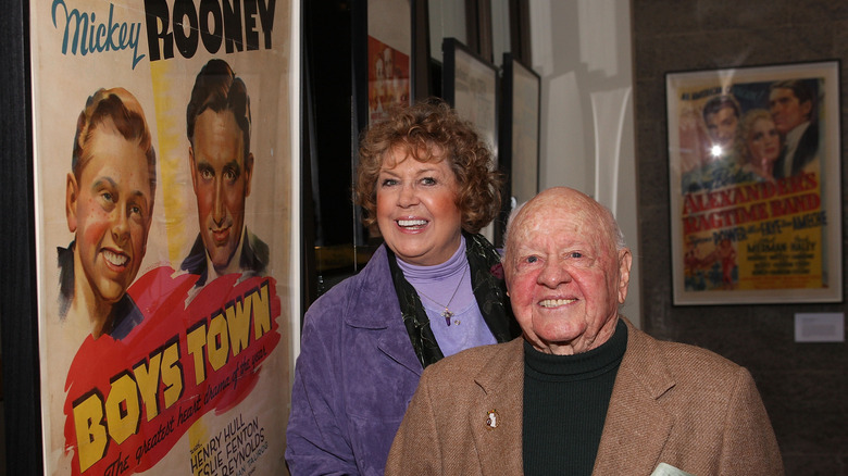 Mickey Rooney and Jan Rooney smiling at event