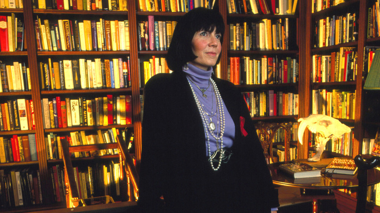 Anne Rice surrounded by books