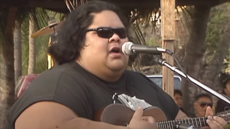 Israel Kamakawiwo'ole performing on beach sunglasses