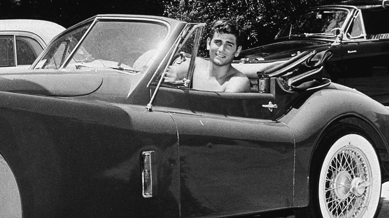 Michael Landon driving a car