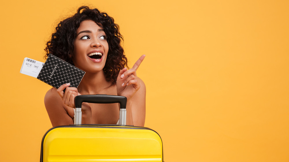 Woman holding a passport case