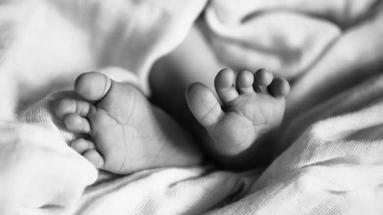 Black and white newborn feet