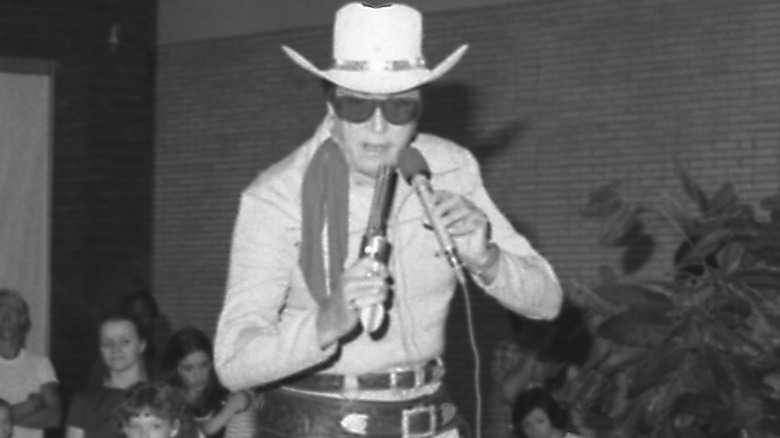 Moore performing onstage as The Lone Ranger