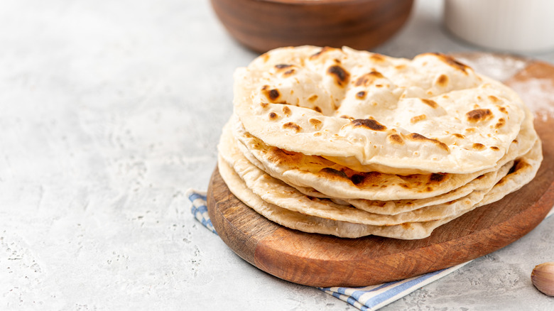 Roti Chapati Flatbread on wooden plate