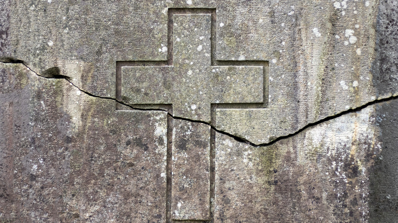 Cracked cross symbolizing division