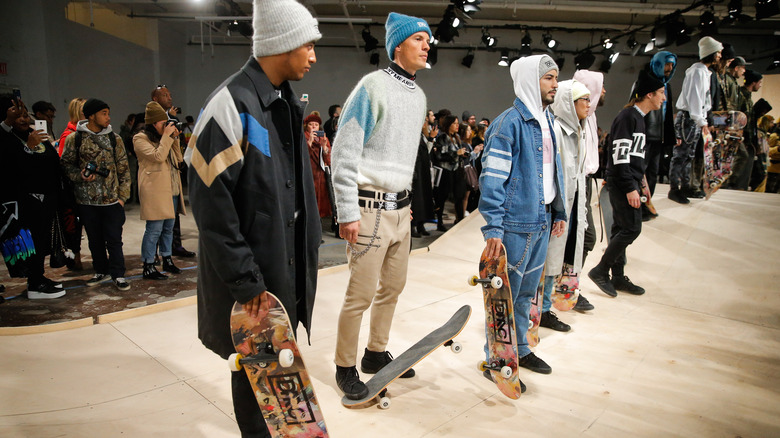 Skateboarders on the runway