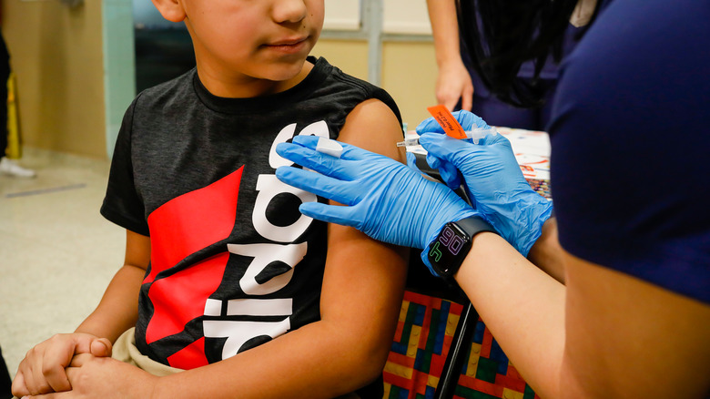 Child receiving covid vax