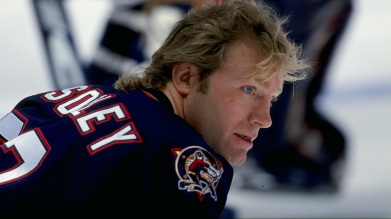 Marty McSorley sitting on the sidelines at a game